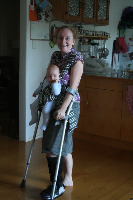 crutches and slinging the baby